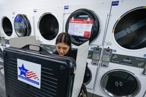 A woman casts her ballot on election day at a polling station inside the Su Nueva laundromat.