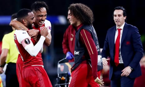 Alexandre Lacazette of Arsenal is congratulated by his teammates.