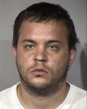 A booking photo provided by the Maricopa County Sheriff’s Office in Phoenix shows Matthew Egler, arrested on one count of arson