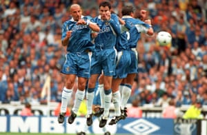 Gianluca Vialli, Gus Poyet and Roberto Di Matteo attempt to block a shot during the 1997 Charity Shield match against Manchester United