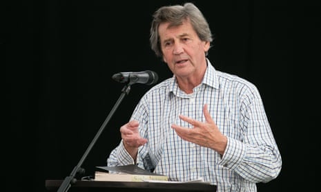 Melvyn Bragg speaking at a lectern