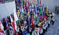 Competing nations and their flag bearers wait to enter the Alexander stadium during the 2022 Commonwealth Games closing ceremony on 8 August 2022