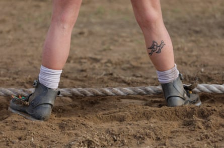 An English competitor with a tug of war tattoo on her calf.