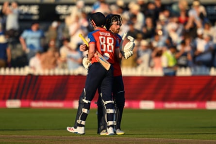 Harry Brook and Phil Salt hug after chasing down the India total