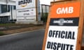 A GMB sign saying 'official dispute' on the street outside the Amazon warehouse in Coventry