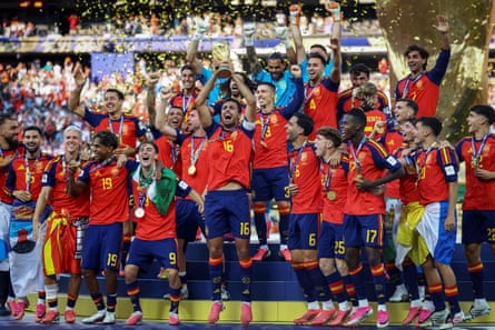 Spain celebrate with the World Cup trophy after winning the final
