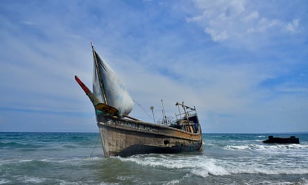 A boat stranded on Indra Patra Beach in Ladong Village, Aceh Province, Indonesia, which arrived carrying dozens of Rohingya refugees.