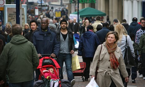 People shop in Kingston Upon Thames town centre in London.