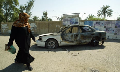 A burnt-out car at the site where Blackwater guards opened fire in western Baghdad on 16 September 2007