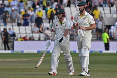 Australia’s Mitchell Marsh, right, and Travis Head leave the field at the end of play
