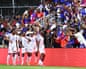 Haiti’s Frantzdy Pierrot celebrates with teammates after scoring against New Zealand during an international friendly in Fort Lauderdale, Florida, in June.