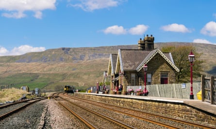 A train approaching Ribblehead station on the Settle-Carlisle line.