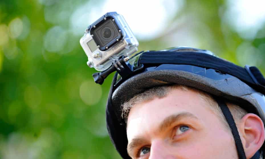 A cyclist wearing a helmet camera