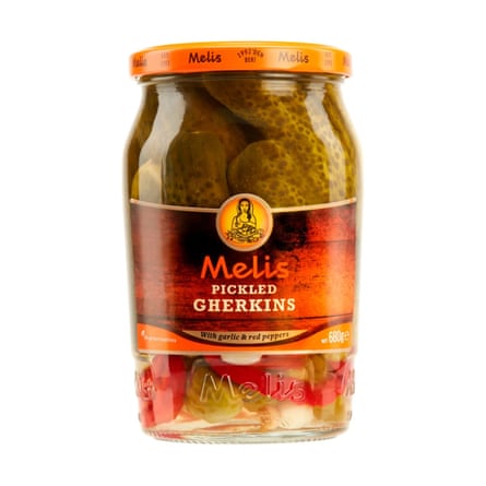 A jar of Melis Pickled Gherkins with an orange lid.