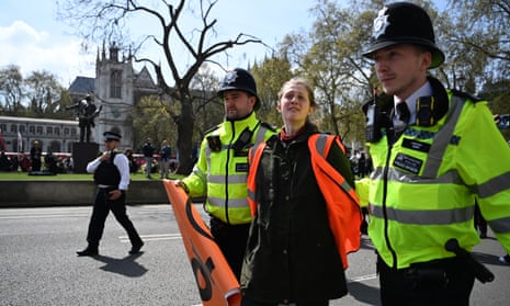 Police arrest a Just Stop Oil protester during a demonstration in central London on 3 May.