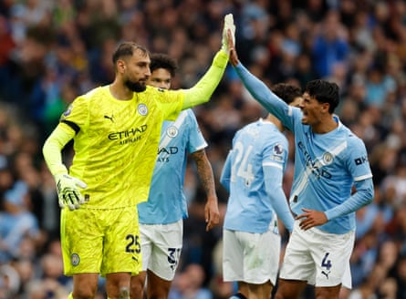 Manchester City’s Gianluigi Donnarumma is congratulated by Tijjani Reijnders after his save from Bryan Mbeumo.