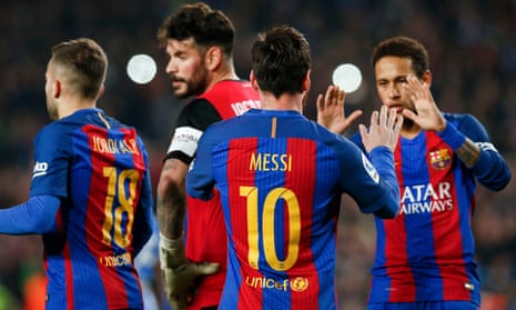 Lionel Messi celebrates after his last-gasp penalty sealed a narrow win for Barcelona.