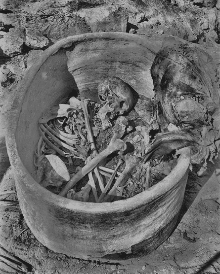 Skeleton remains in a pottery vessel.