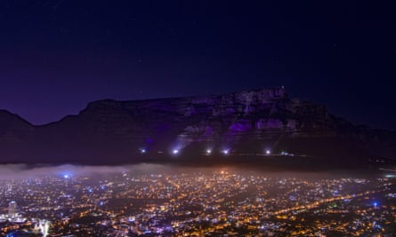 Table Mountain in Cape Town is lit up in purple on Sunday in memory of Desmond Tutu.