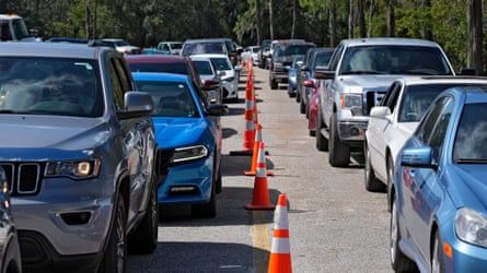 Motorists wait in long lines for fuel at a newly opened depot after Hurricane Milton on Saturday, in Plant City, Florida.