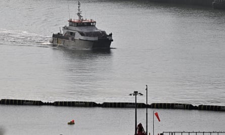 A UK Border Forcce vessel carrying migrants picked up at sea arrives at Dover on 7 September, days after 12 people perished trying to cross the Channel in a dinghy.