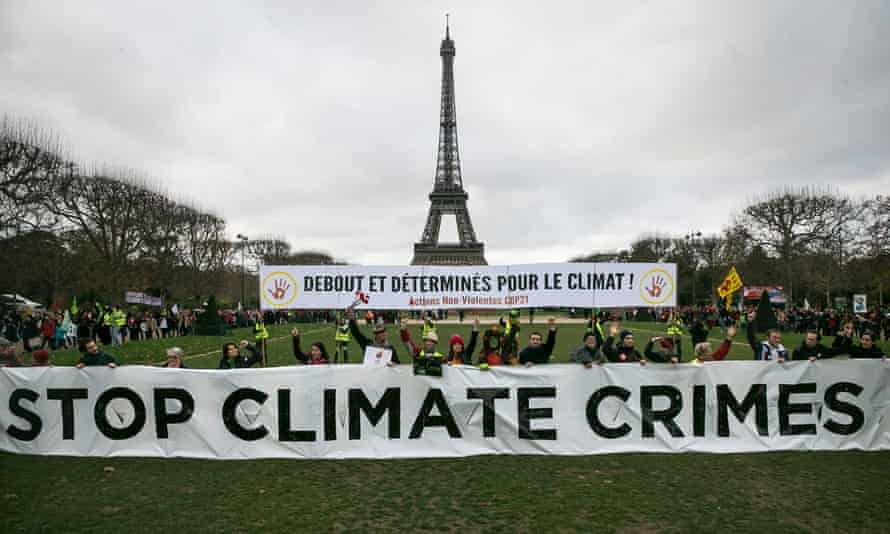 Activists demonstrate in front of the Eiffel Tower