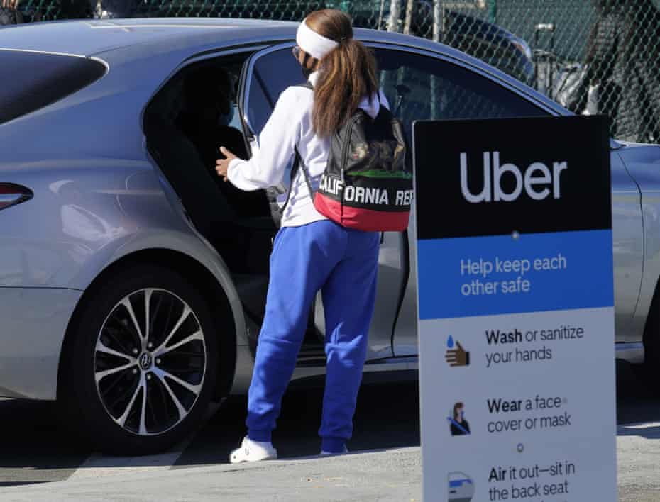 An Uber ride at Los Angeles international airport. Rideshare drivers fear for their safety amid Covid.