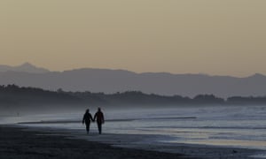 Couple walk on beach