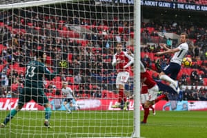 Harry Kane rises to head home.
