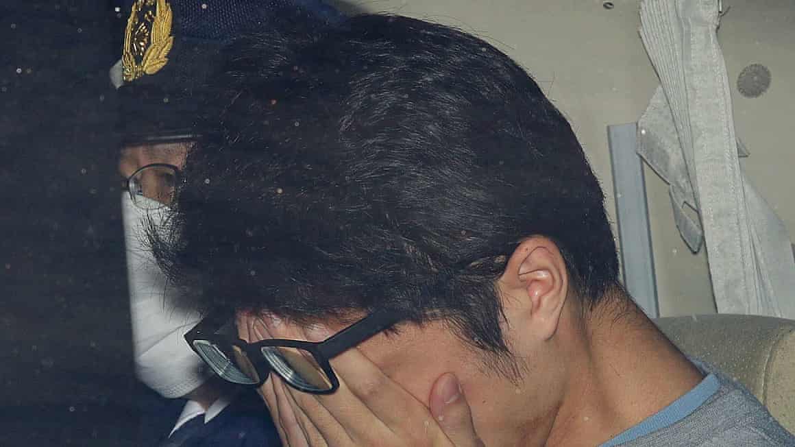 Takahiro Shiraishi in a police car in Tokyo in 2017