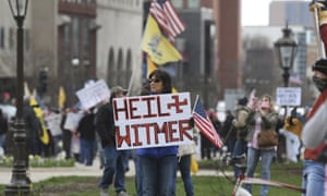 Rallygoers protest against Michigan governor Gretchen Whitmer’s stay-at-home order, at the state Capitol Wednesday, April 15, 2020, in downtown Lansing.