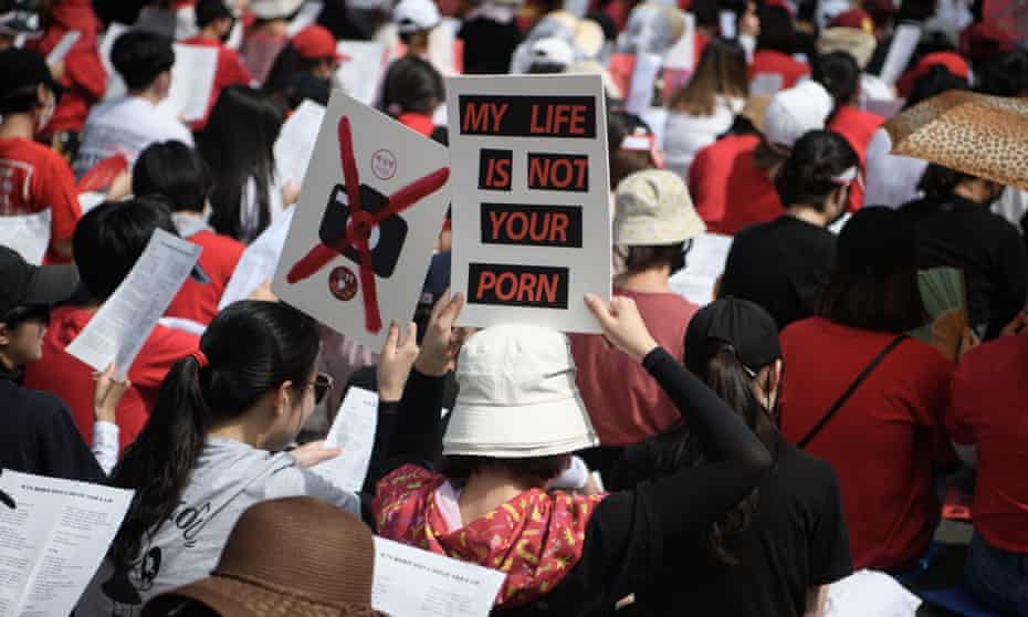 Female protesters call for South Korea’s government to crack down on widespread spycam porn crimes during a rally in Seoul