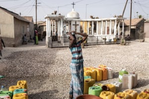 A woman collects water