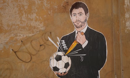 A mural seen in Rome around the time of Juve’s links with the European Super League, depicting Agnelli stabbing a football.
