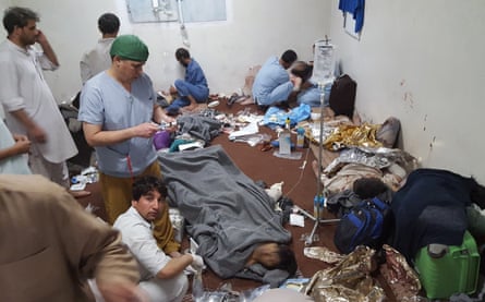 Medical staff treat wounded colleagues and patients in a hospital in Kunduz, on 3 October 2015, in the aftermath of an airstrike on the facility in the northern Afghan city.