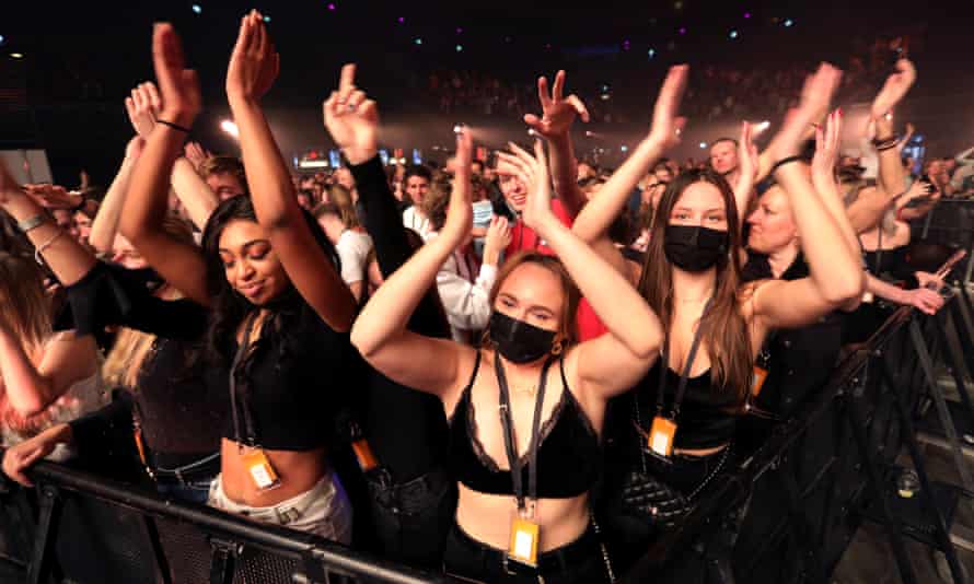 People attend a music event at Ziggo Dome venue, which opened its doors to small groups of people that have been tested negative of the coronavirus disease (COVID-19) in Amsterdam, Netherlands March 6, 2021.