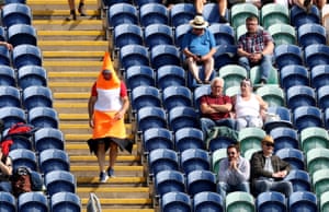 A traffic cone walks down the Fosters stand.