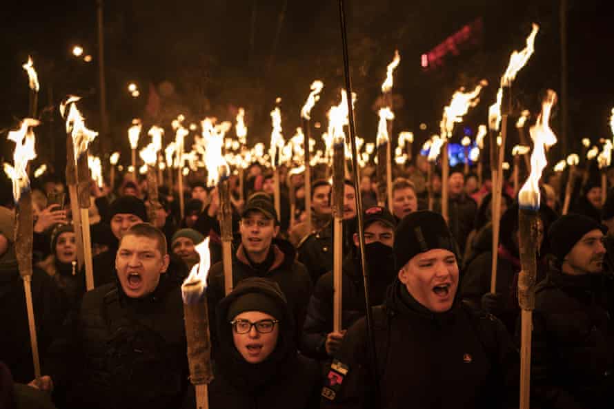 Nationalists carry torches at a rally to mark the birthday of Stepan Bandera in Kiev, Ukraine.