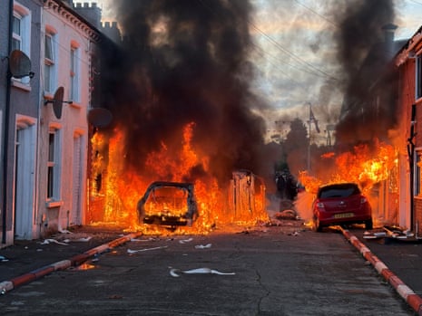 Vehicles set on fire by protesters on Lendrick Street in Belfast, as disorder flared in response to Monday night's stabbing attack in the city.