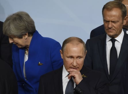 The former British PM Theresa May, the Russian president, Vladimir Putin, and Donald Tusk, who stepped down as president of the European Council this year, at the G20 summit in Hamburg last year.