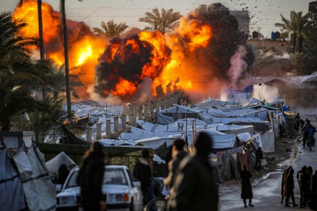 Fire and smoke rises after an explosion near a tent encampment