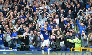Aaron Lennon celebrates with Steven Naismith after Naismith scored his hat-trick.