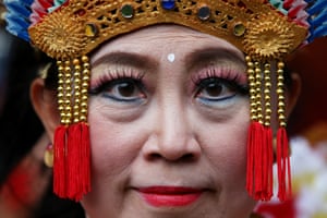 A performer prepares to go stage in Hay Street in the Chinatown district in Sydney, Australia.