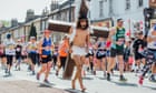 London Marathon: huge crowds spur on runners in hottest race ever