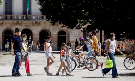People enjoy a sunny day at Milan’s Sempione park as the lockdown in Italy is gradually eased.
