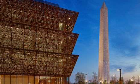 The Smithsonian National Museum of African American History and Culture sits in the shadow of the Washington monument.