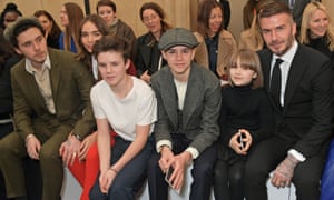David Beckham with his children attending London fashion week in February 2019