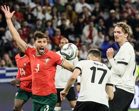 Rúben Dias appeals for a foul as Florian Wirtz heads Germany in front.