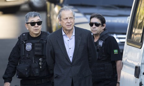 José Dirceu, former chief of staff to the former president Luiz Inácio Lula da Silva, is escorted to federal police headquarters in Curitiba in August 2015.