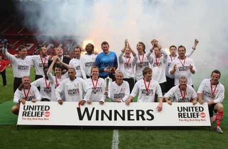 The Celebrity Rivals XI celebrate after beating a Manchester United Legends XI (with Max Rushden second from left, back row).